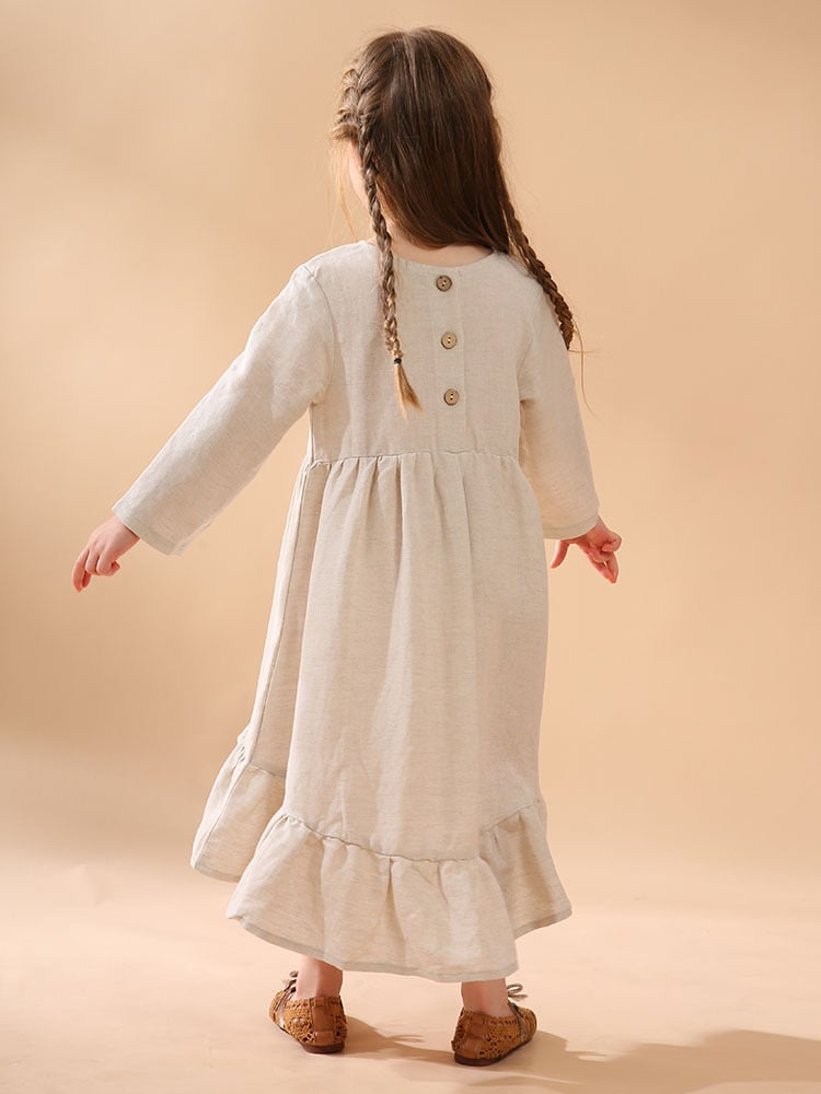 A girl's cotton and linen dress with an irregular hem