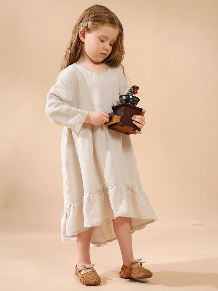 A girl's cotton and linen dress with an irregular hem