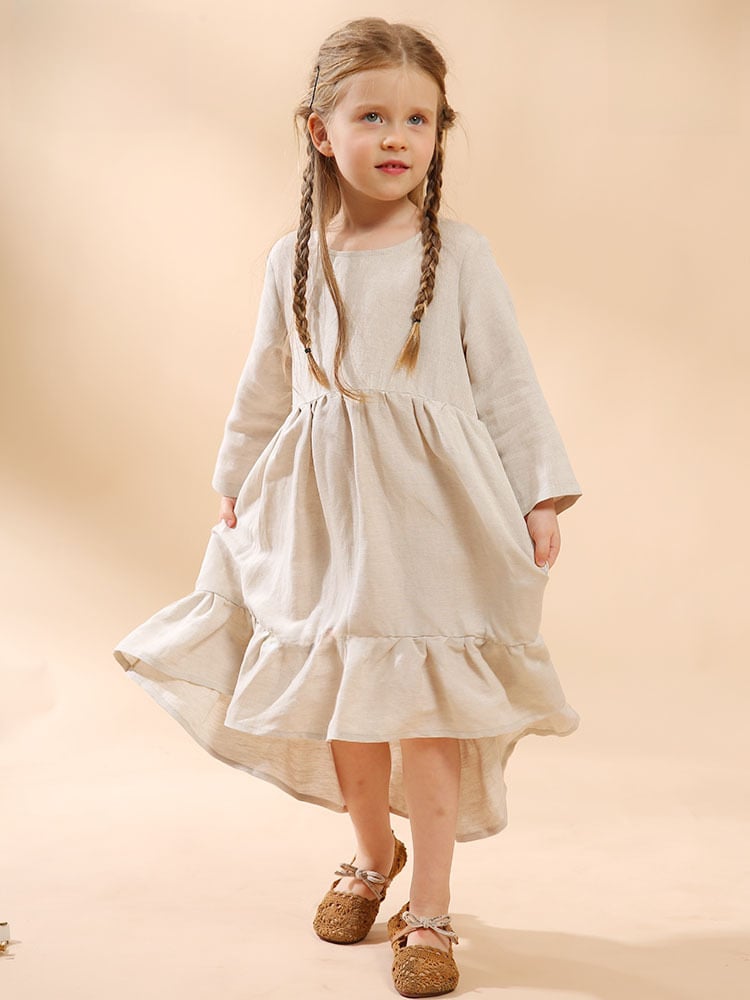 A girl's cotton and linen dress with an irregular hem