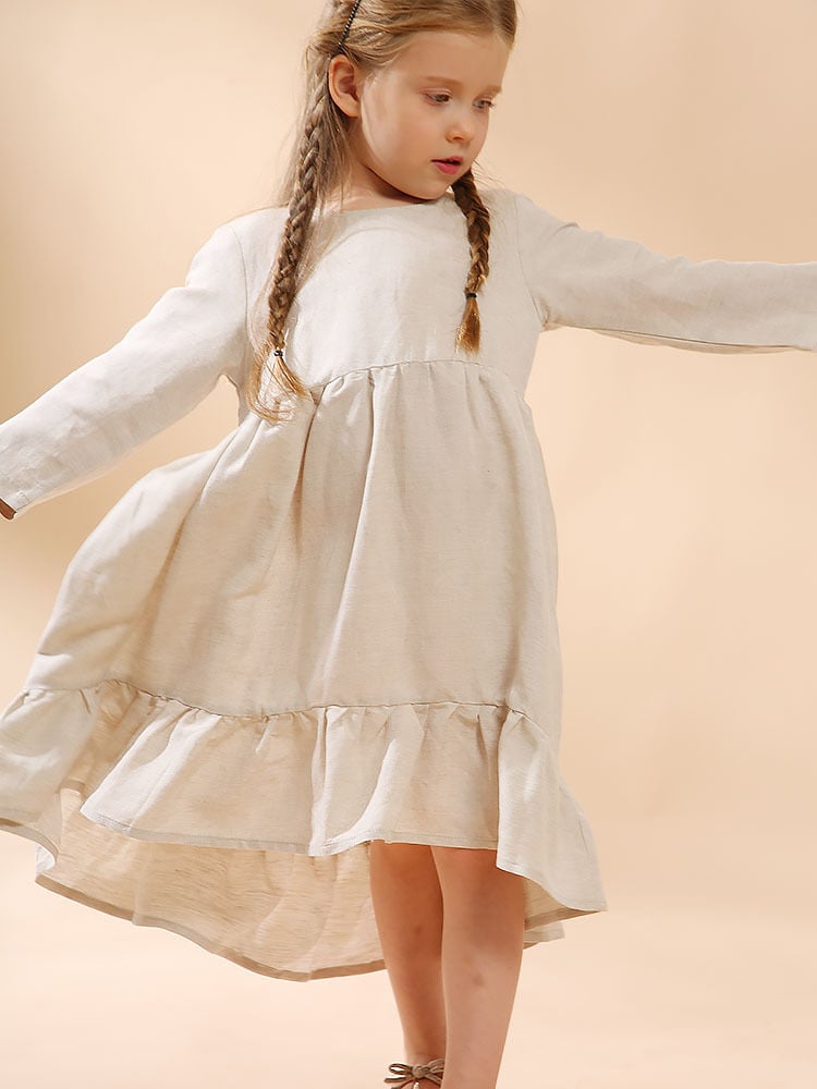 A girl's cotton and linen dress with an irregular hem