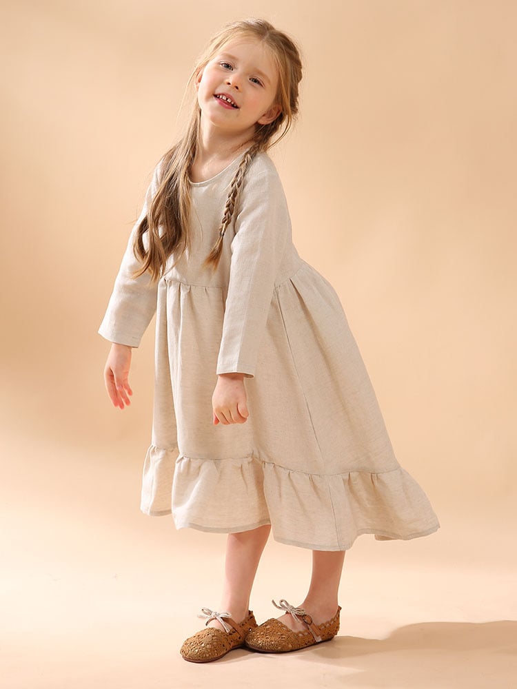A girl's cotton and linen dress with an irregular hem